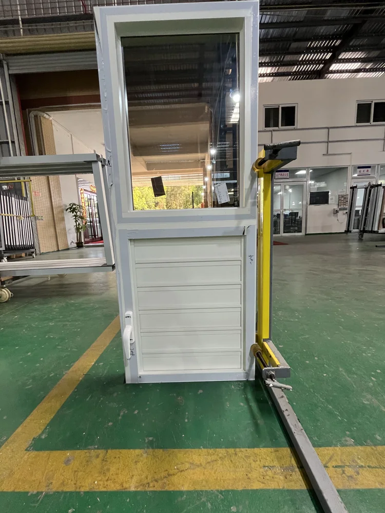 Open glazed door assembly during factory inspection for the St. Lucia order