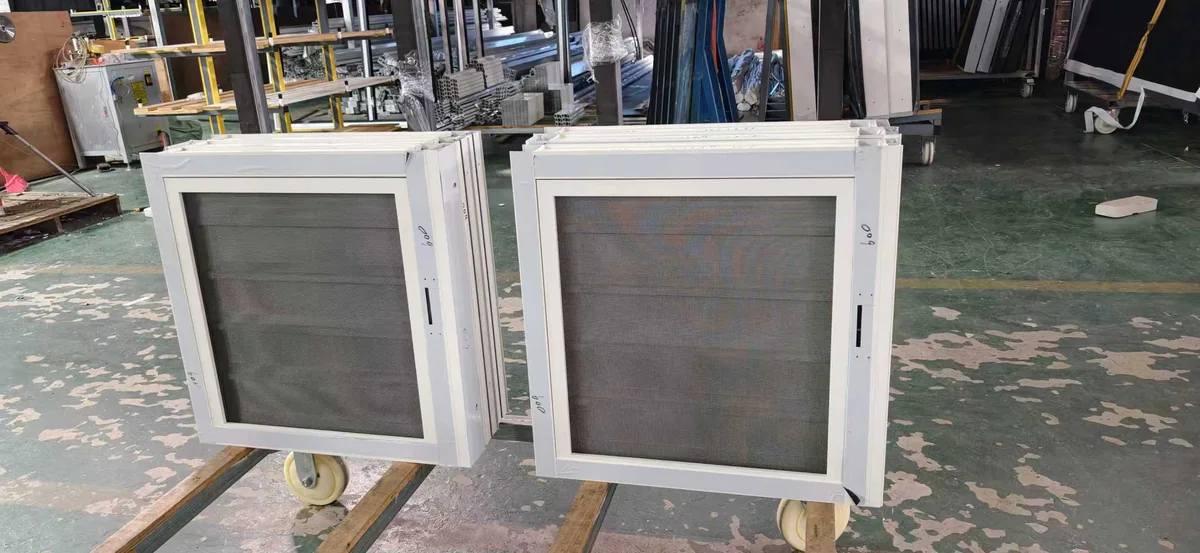Two white-framed window units with mesh screens for the St. Lucia order